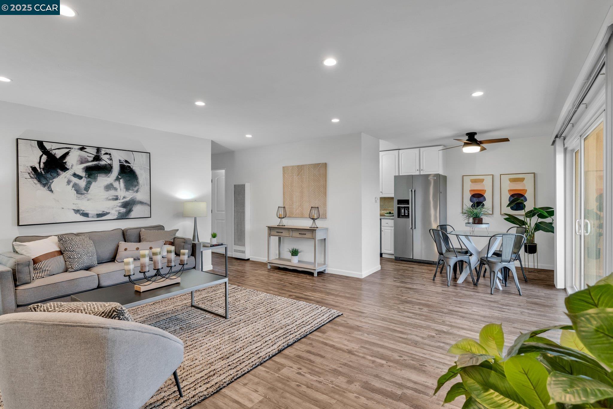 2600 Jones Road, Unit 18 Walnut Creek, CA 94597 - Photo 1 of 1 a living room with furniture and wooden floor