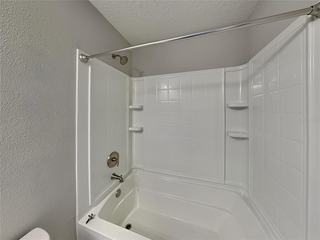 944 West Rum Place Dunnellon, FL 34434 - Photo 13 of 16 a bathroom with a bathtub and a shower