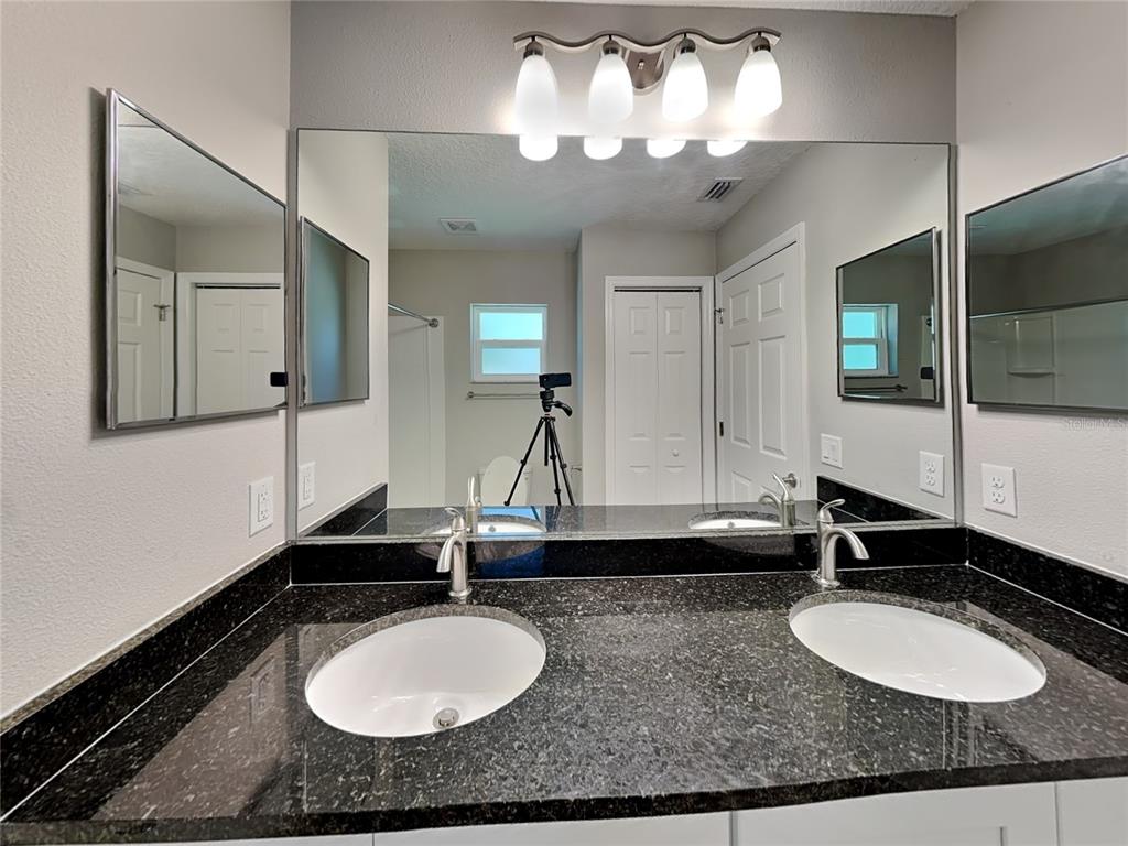 944 West Rum Place Dunnellon, FL 34434 - Photo 6 of 16 a bathroom with a sink and a mirror