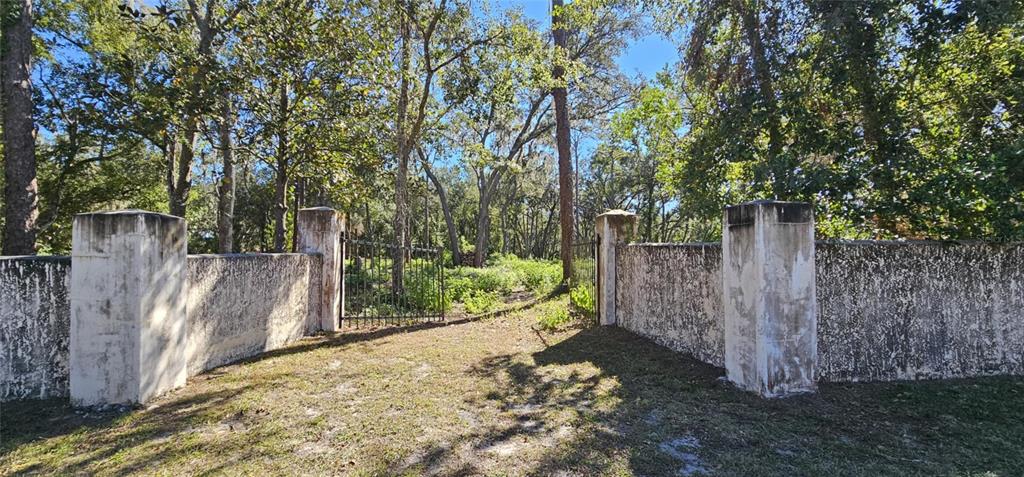 Piermaj Lane Lutz, FL 33549 - Photo 8 of 15 a view of a backyard with wooden fence and large trees