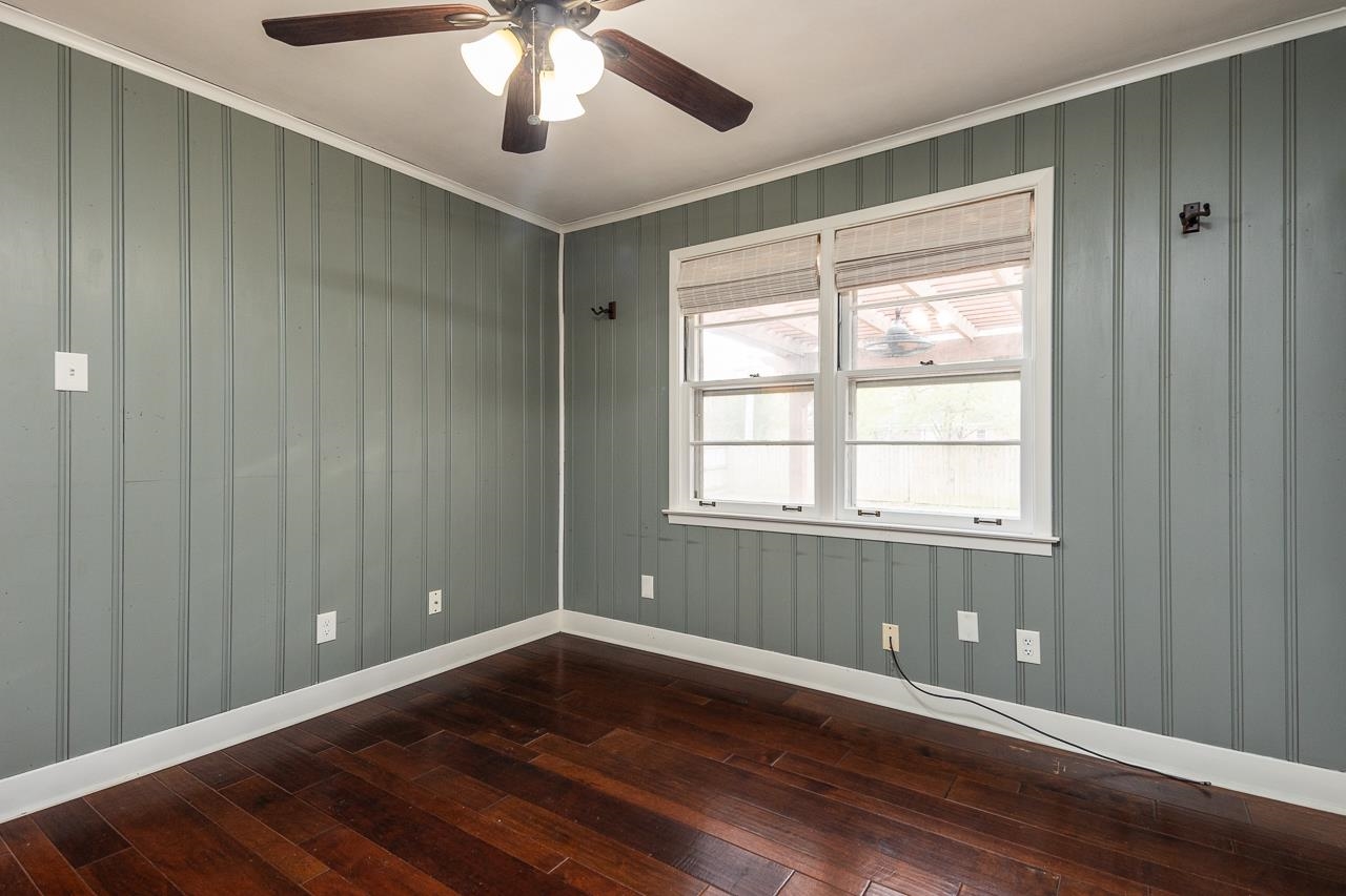 4923 Kaye Road Memphis, TN 38117 - Photo 13 of 21 a view of an empty room with wooden floor and a window