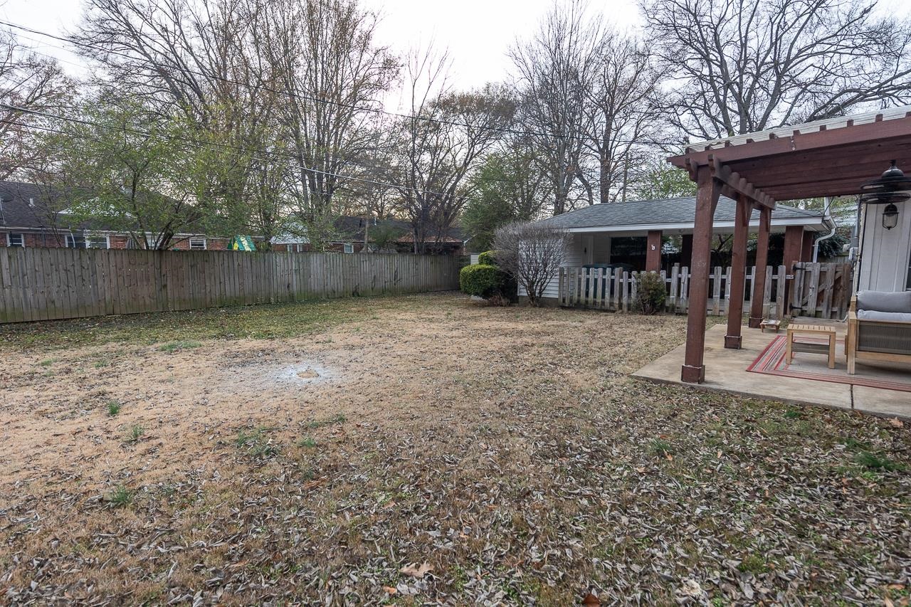 4923 Kaye Road Memphis, TN 38117 - Photo 18 of 21 a view of a house with a yard and wooden fence