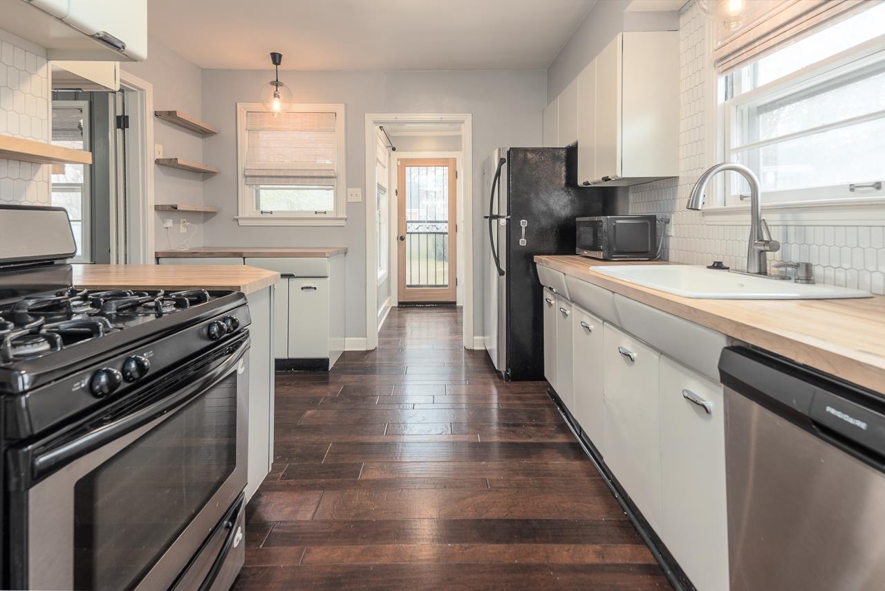 4923 Kaye Road Memphis, TN 38117 - Photo 6 of 21 a kitchen with a stove a sink and a refrigerator