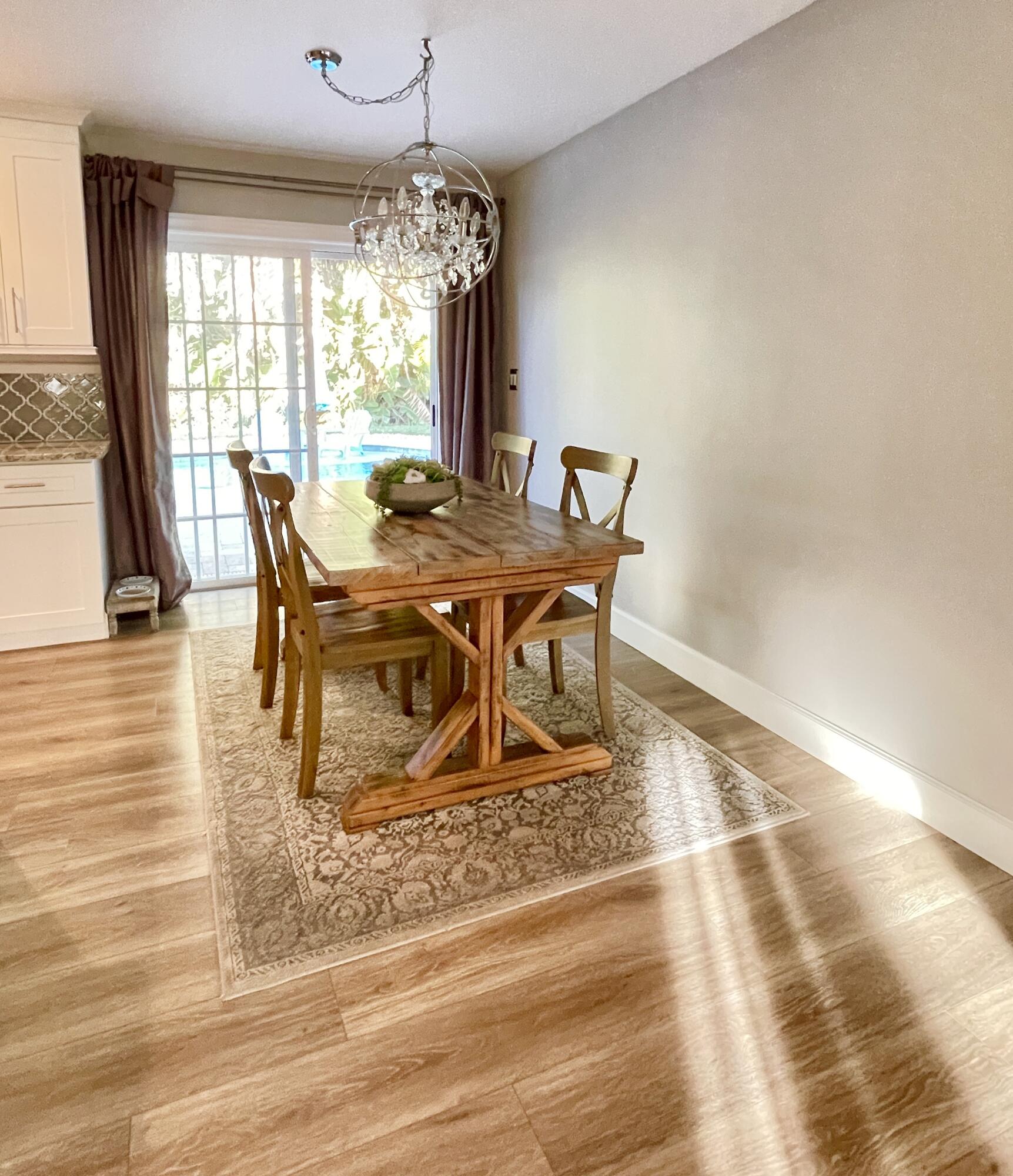 103 East Riverside Drive Jupiter, FL 33469 - Photo 13 of 66 Dining area looks out to pool