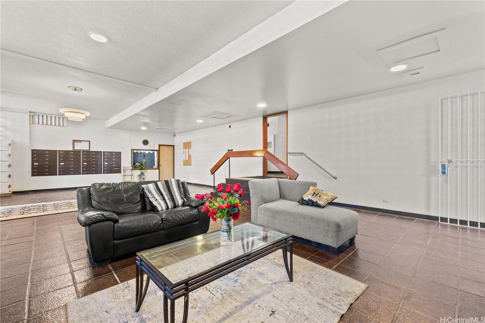 1069 Spencer Street, Unit 101 Honolulu, HI 96822 - Photo 16 of 19 a living room with furniture and kitchen view