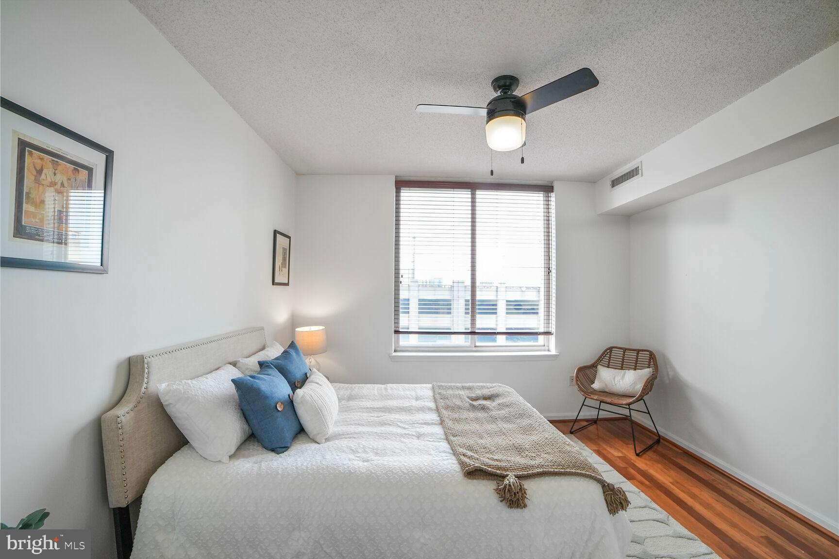 930 Wayne Avenue, Unit 708 Silver Spring, MD 20910 - Photo 19 of 35 a bedroom with a bed and window