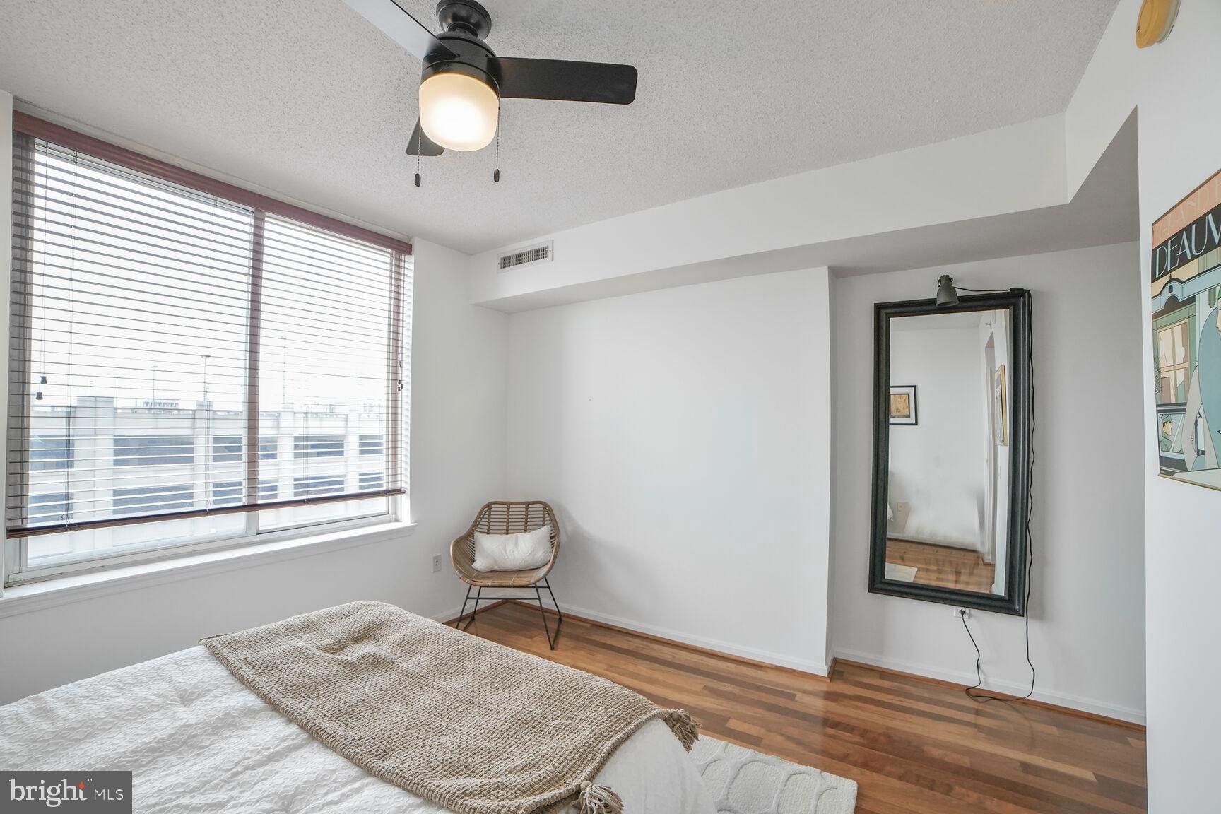 930 Wayne Avenue, Unit 708 Silver Spring, MD 20910 - Photo 20 of 35 a view of a room with a window and ceiling fan
