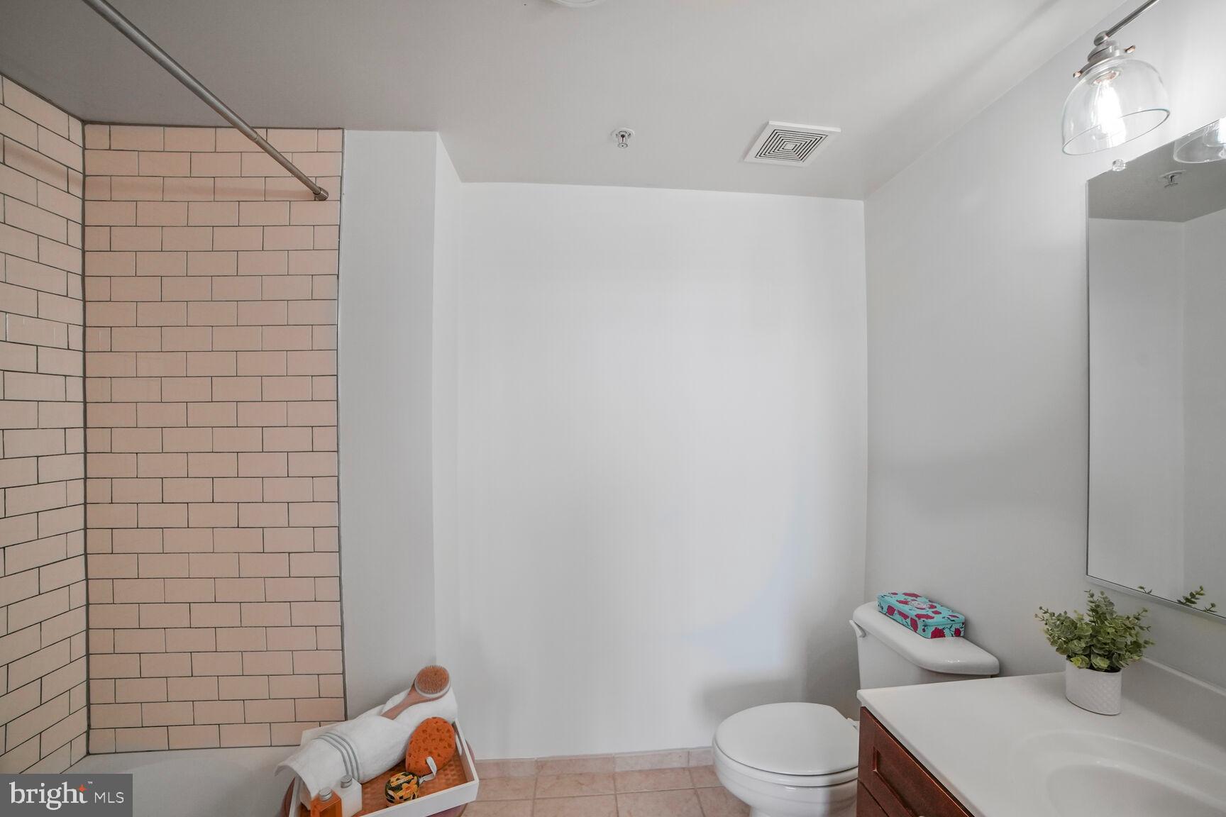 930 Wayne Avenue, Unit 708 Silver Spring, MD 20910 - Photo 21 of 35 a bathroom with a toilet and a sink