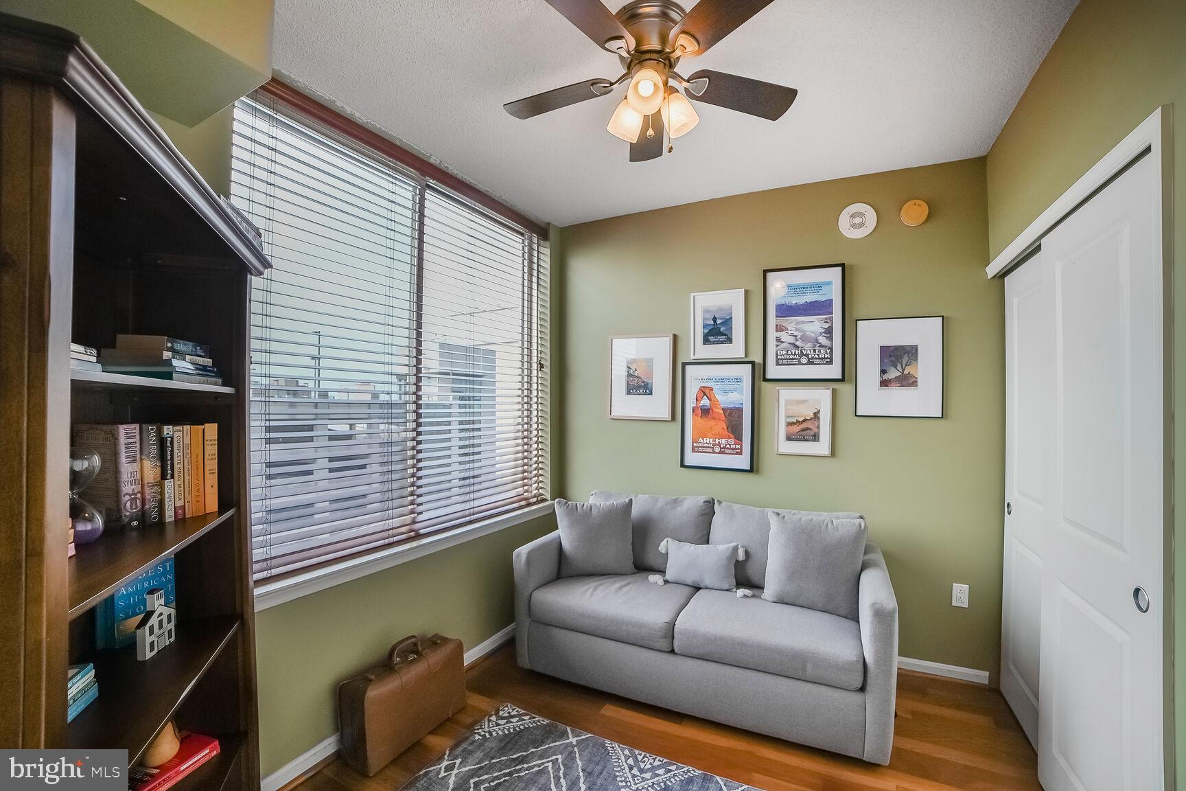 930 Wayne Avenue, Unit 708 Silver Spring, MD 20910 - Photo 22 of 35 a living room with furniture and a window