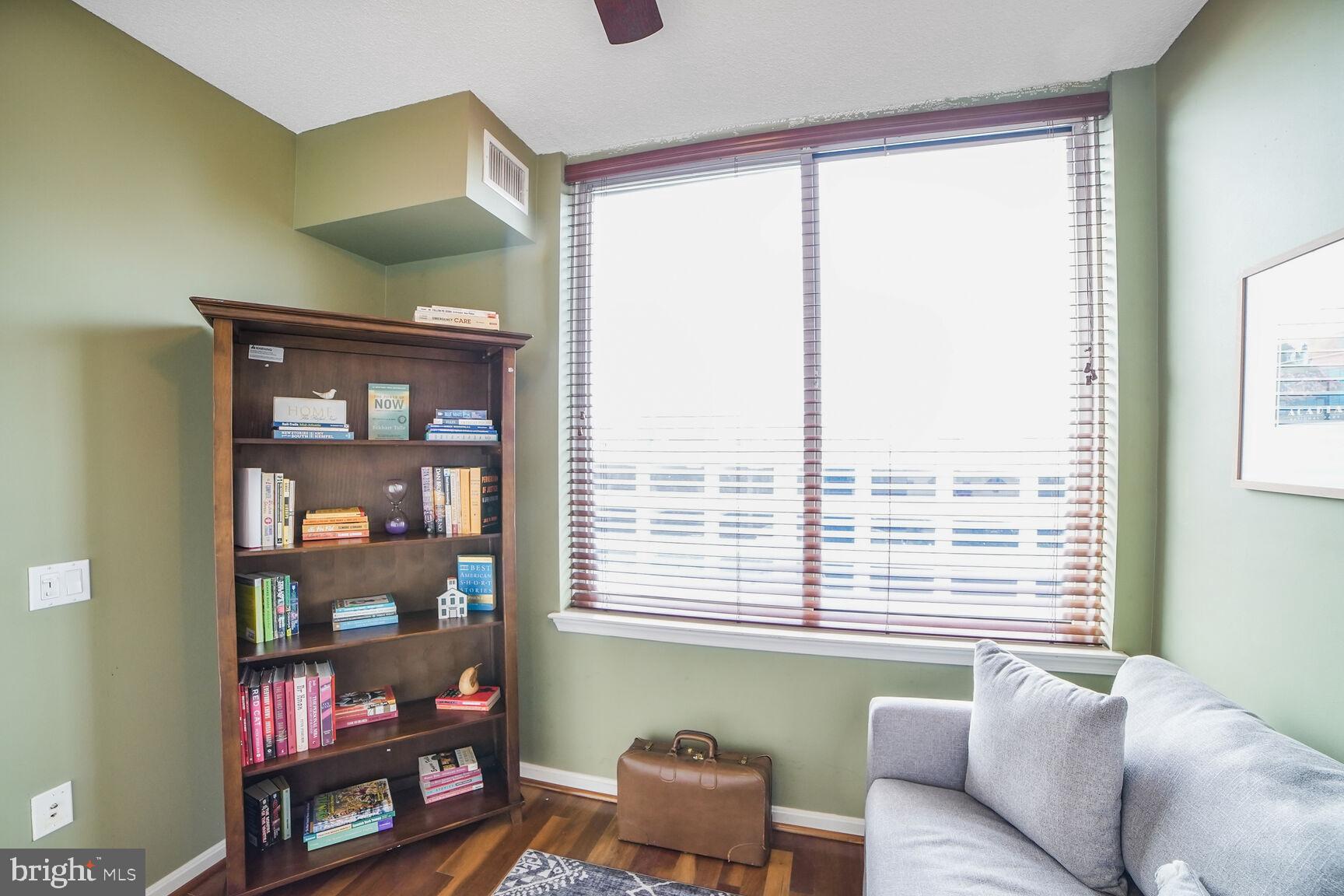 930 Wayne Avenue, Unit 708 Silver Spring, MD 20910 - Photo 23 of 35 a living room with furniture and a window
