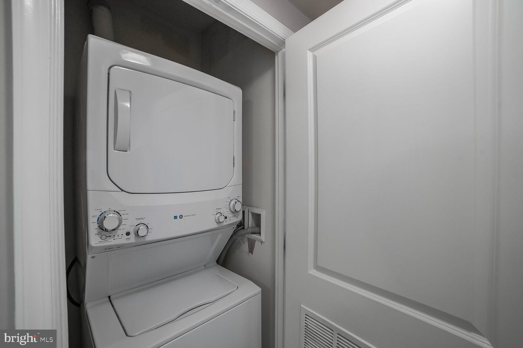 930 Wayne Avenue, Unit 708 Silver Spring, MD 20910 - Photo 26 of 35 a utility room with dryer and washer