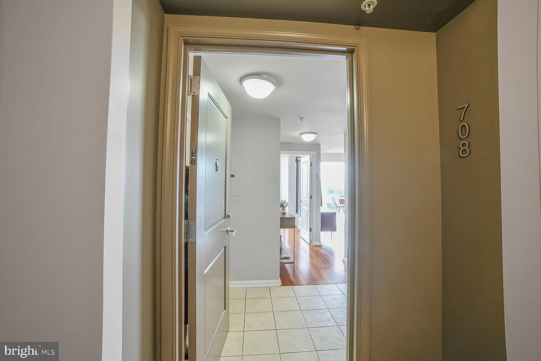 930 Wayne Avenue, Unit 708 Silver Spring, MD 20910 - Photo 6 of 35 a view of a bathroom from a hallway