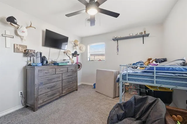 a room with furniture and a flat screen tv