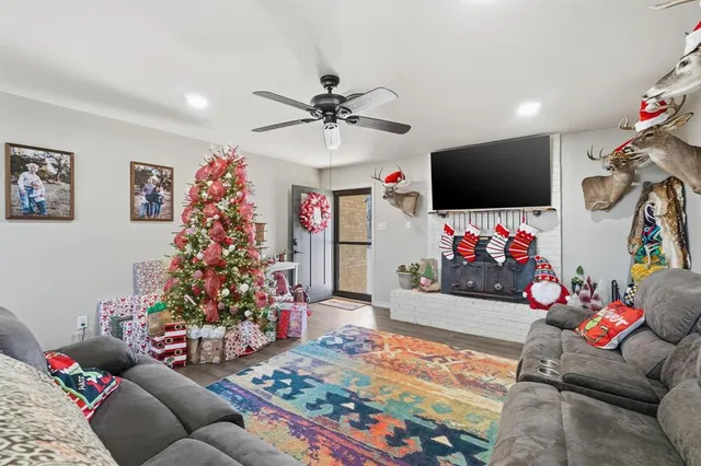 a living room filled with furniture and a flat screen tv