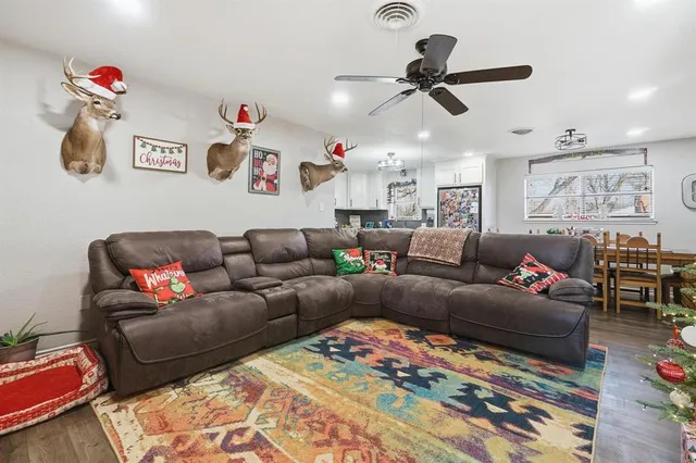 a living room with furniture and a rug