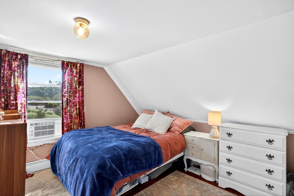 4 South Highland Road, Unit C Truro, MA 02666 - Photo 14 of 21 a bedroom with a bed and window
