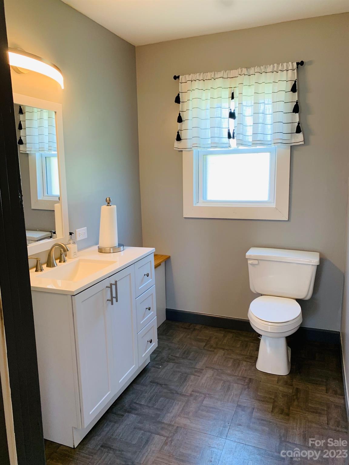 624 Main Street Hudson, NC 28638 - Photo 14 of 17 a bathroom with a sink toilet and mirror