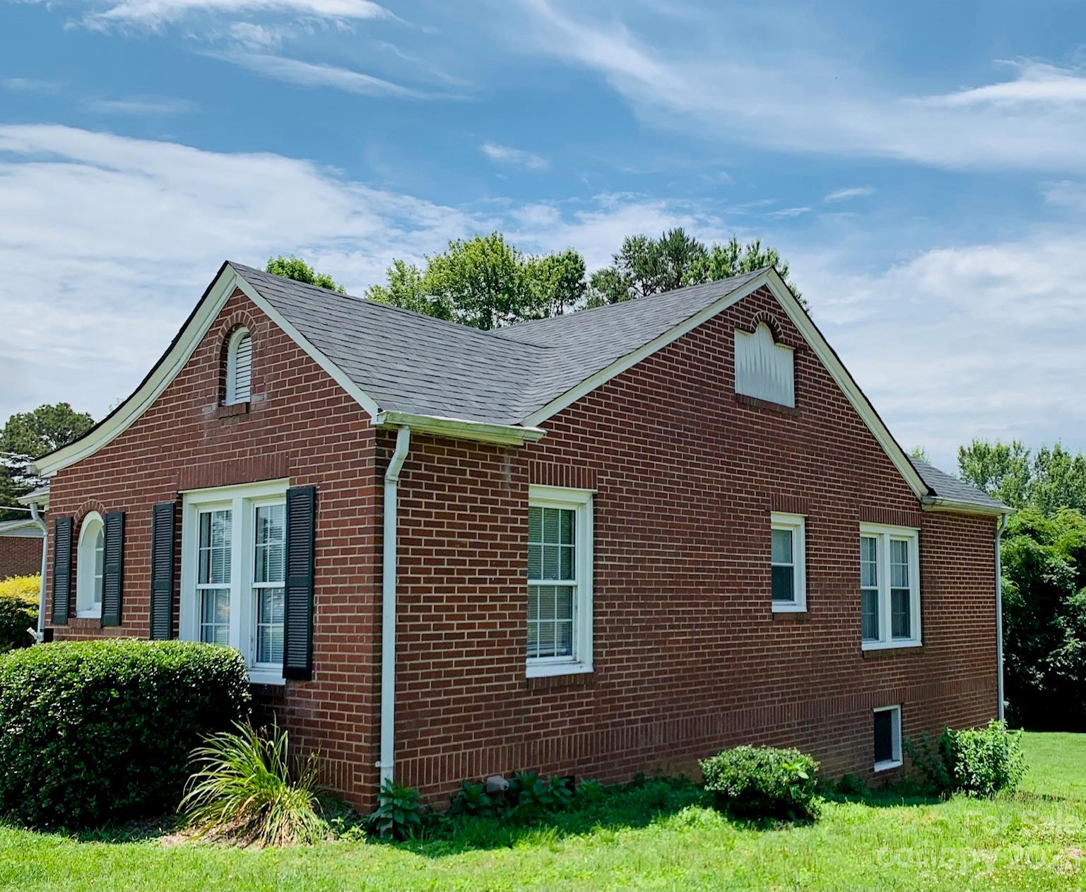 624 Main Street Hudson, NC 28638 - Photo 2 of 17 a front view of a house with a yard