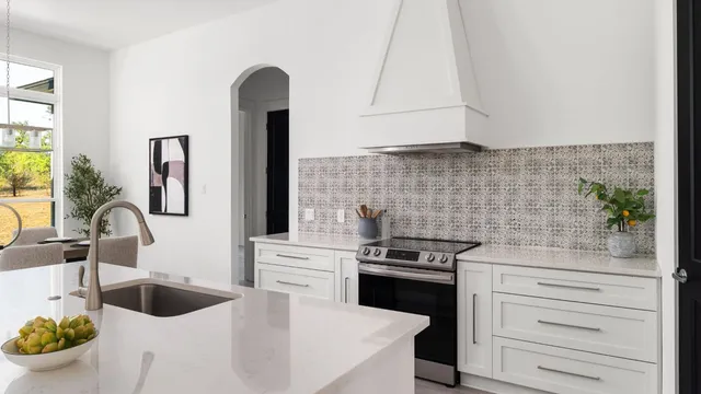 a kitchen with a sink and wooden floor