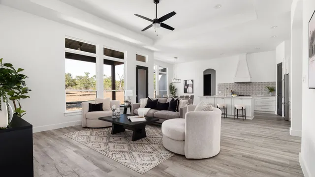 a kitchen with stainless steel appliances kitchen island granite countertop a dining table and chairs