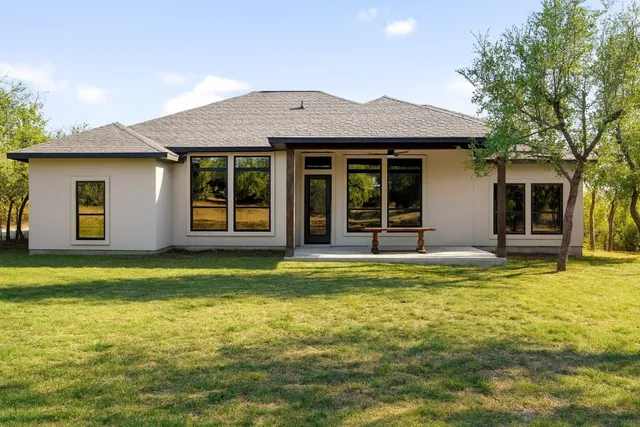 an aerial view of house with a street