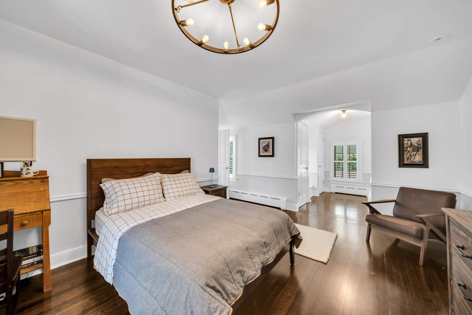 32 Otis Road Barrington Hills, IL 60010 - Photo 25 of 48 a spacious bedroom with a bed a dresser and wooden floor