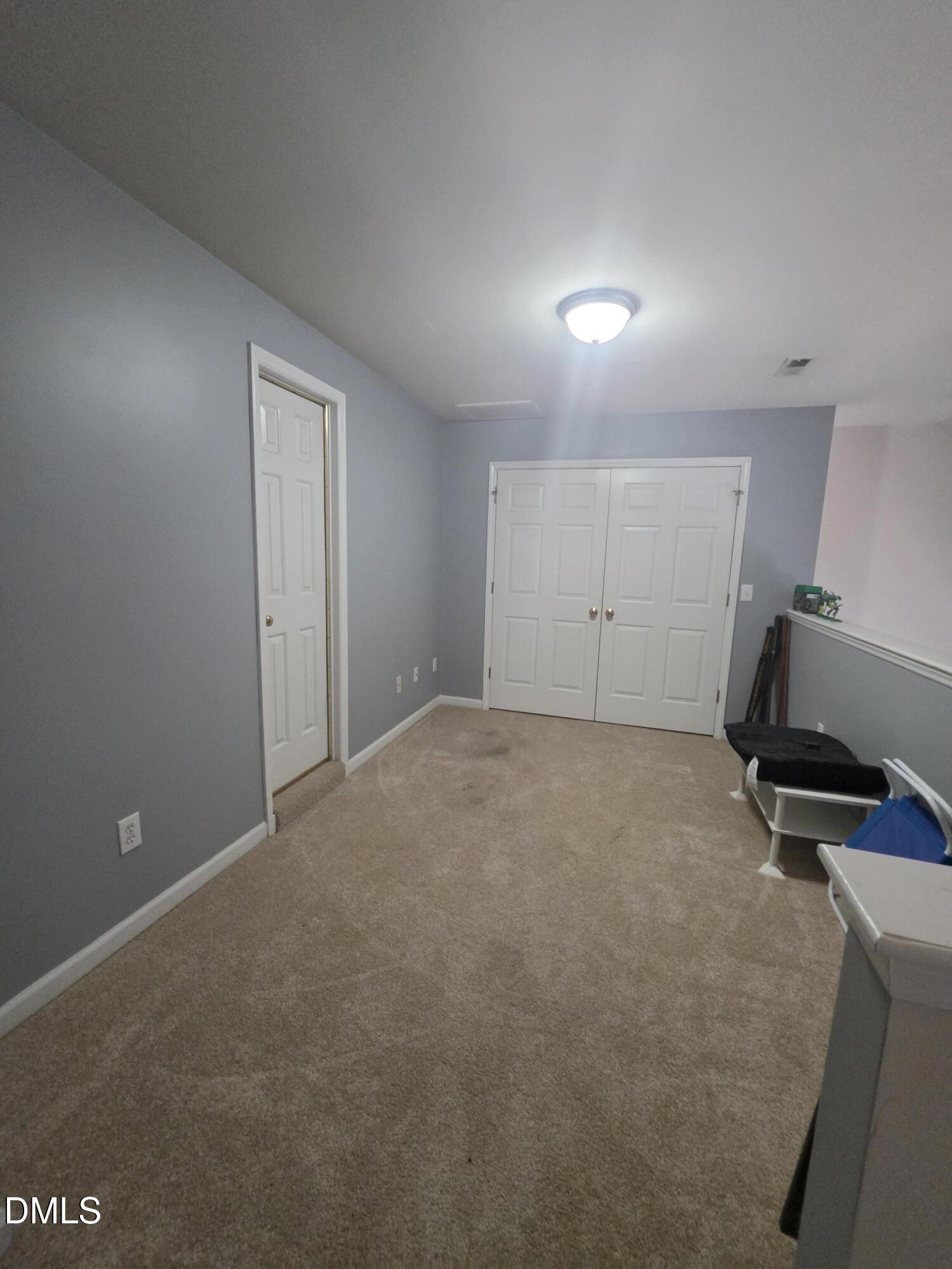 2405 Trout Stream Drive Raleigh, NC 27604 - Photo 10 of 13 a view of a room with gym equipment