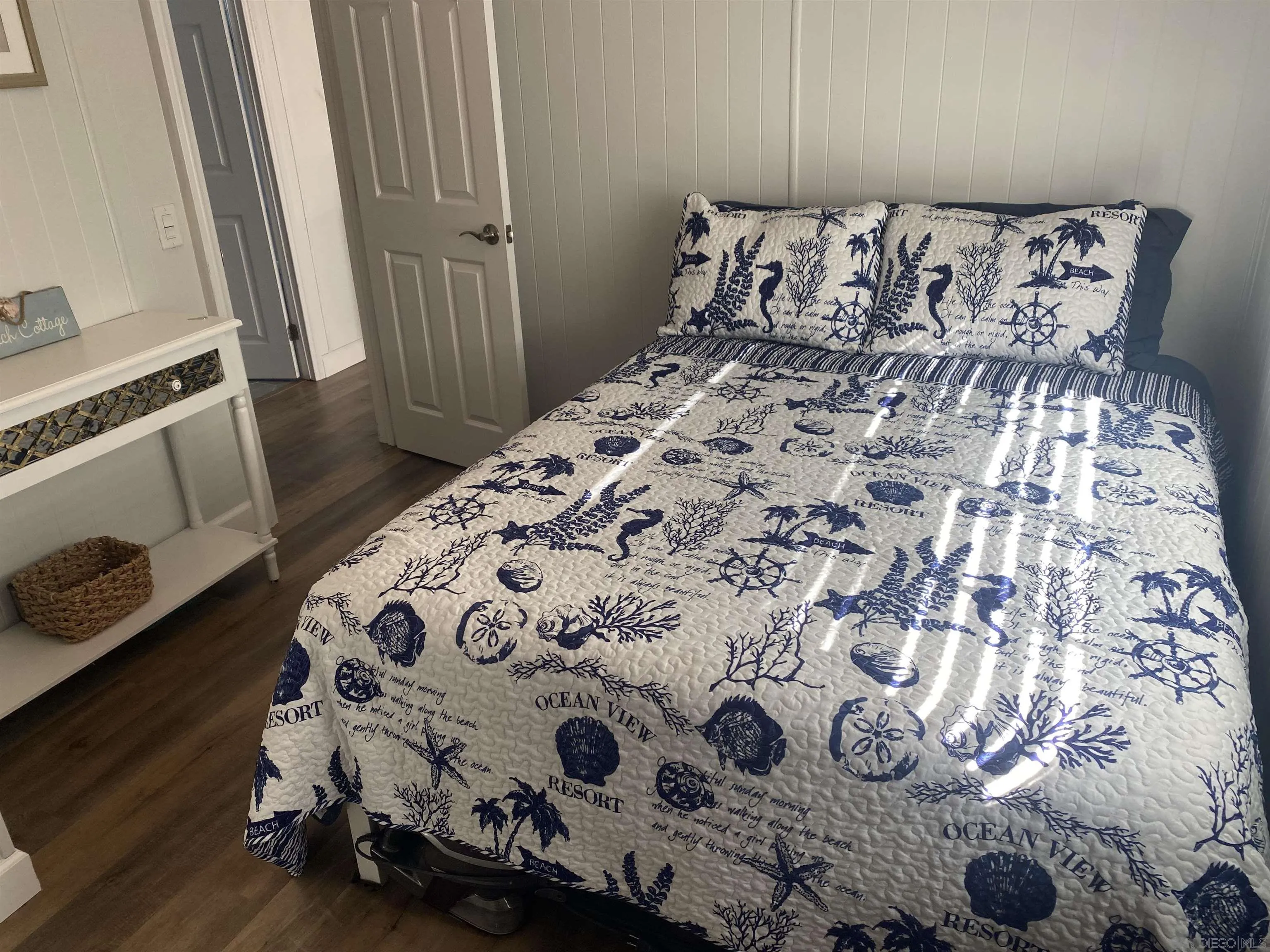 900 North Cleveland Street, Unit 33 Oceanside, CA 92054 - Photo 14 of 23 a bed sitting in a bedroom next to a window