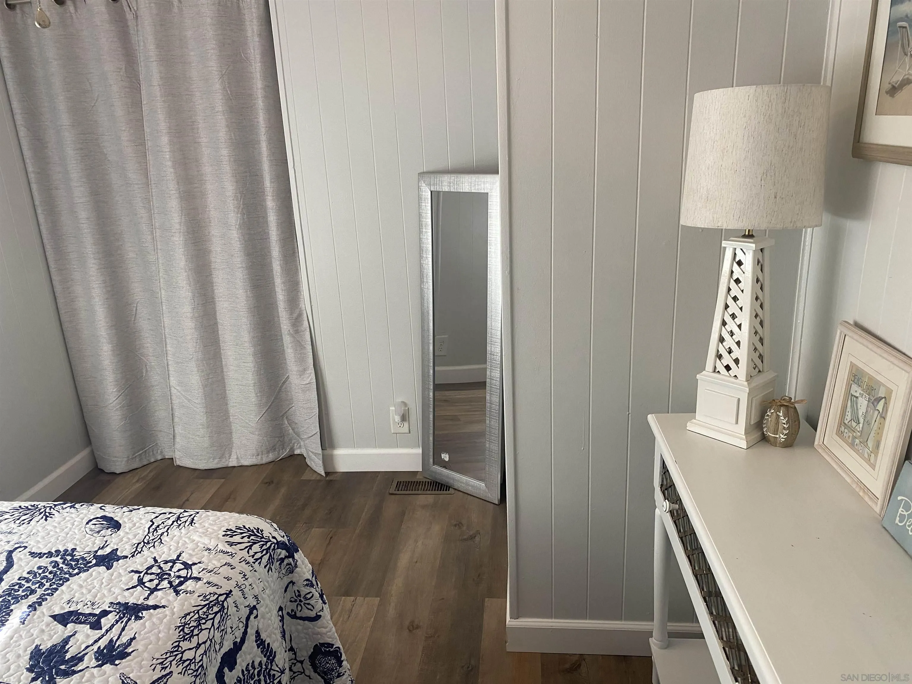 900 North Cleveland Street, Unit 33 Oceanside, CA 92054 - Photo 15 of 23 a bedroom with a bed and a table in it