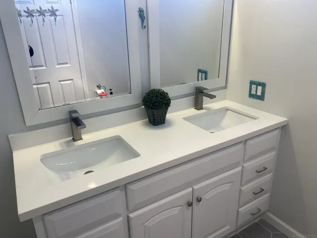 a bathroom with sink and mirror