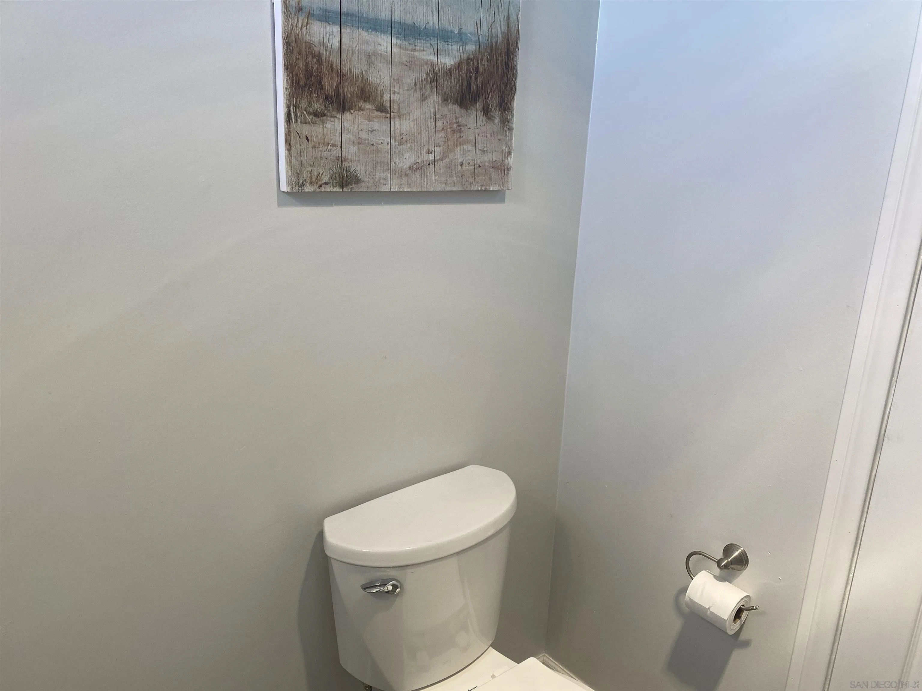900 North Cleveland Street, Unit 33 Oceanside, CA 92054 - Photo 18 of 23 a white toilet sitting next to a white wall