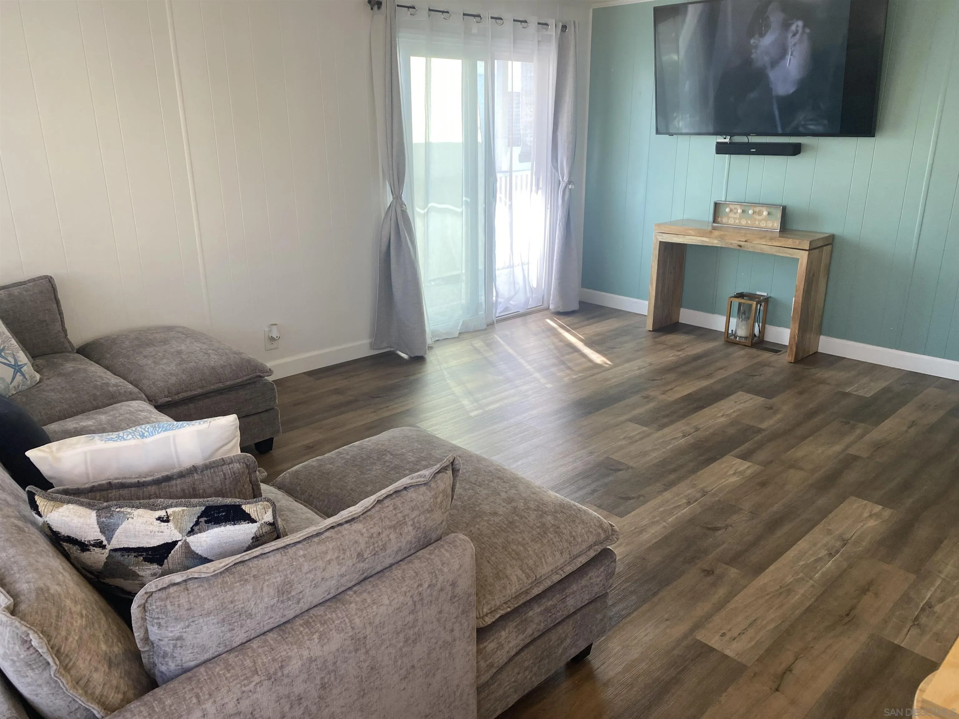 900 North Cleveland Street, Unit 33 Oceanside, CA 92054 - Photo 5 of 23 a living room with furniture and a fireplace