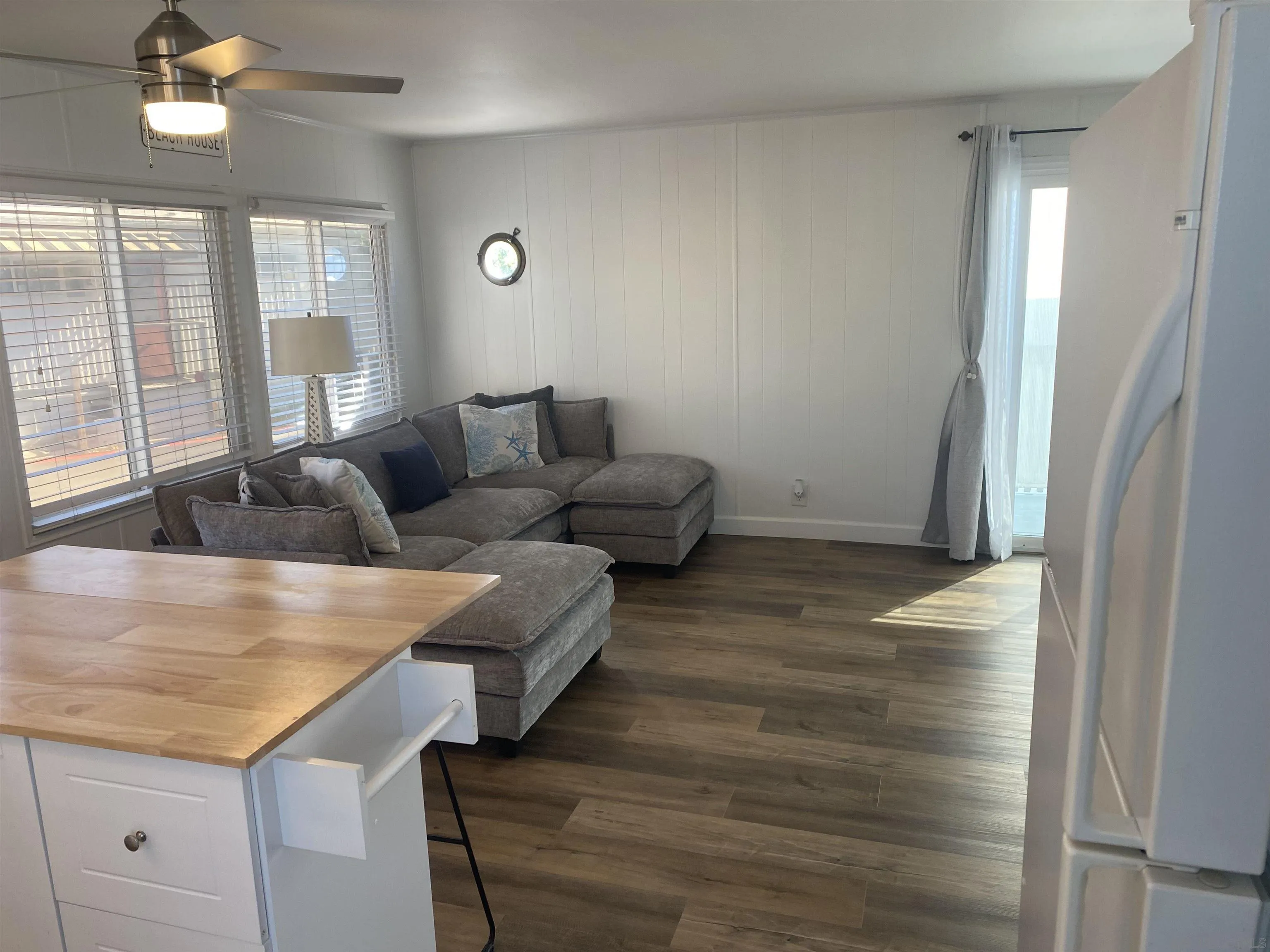 900 North Cleveland Street, Unit 33 Oceanside, CA 92054 - Photo 6 of 23 a living room with furniture and wooden floor