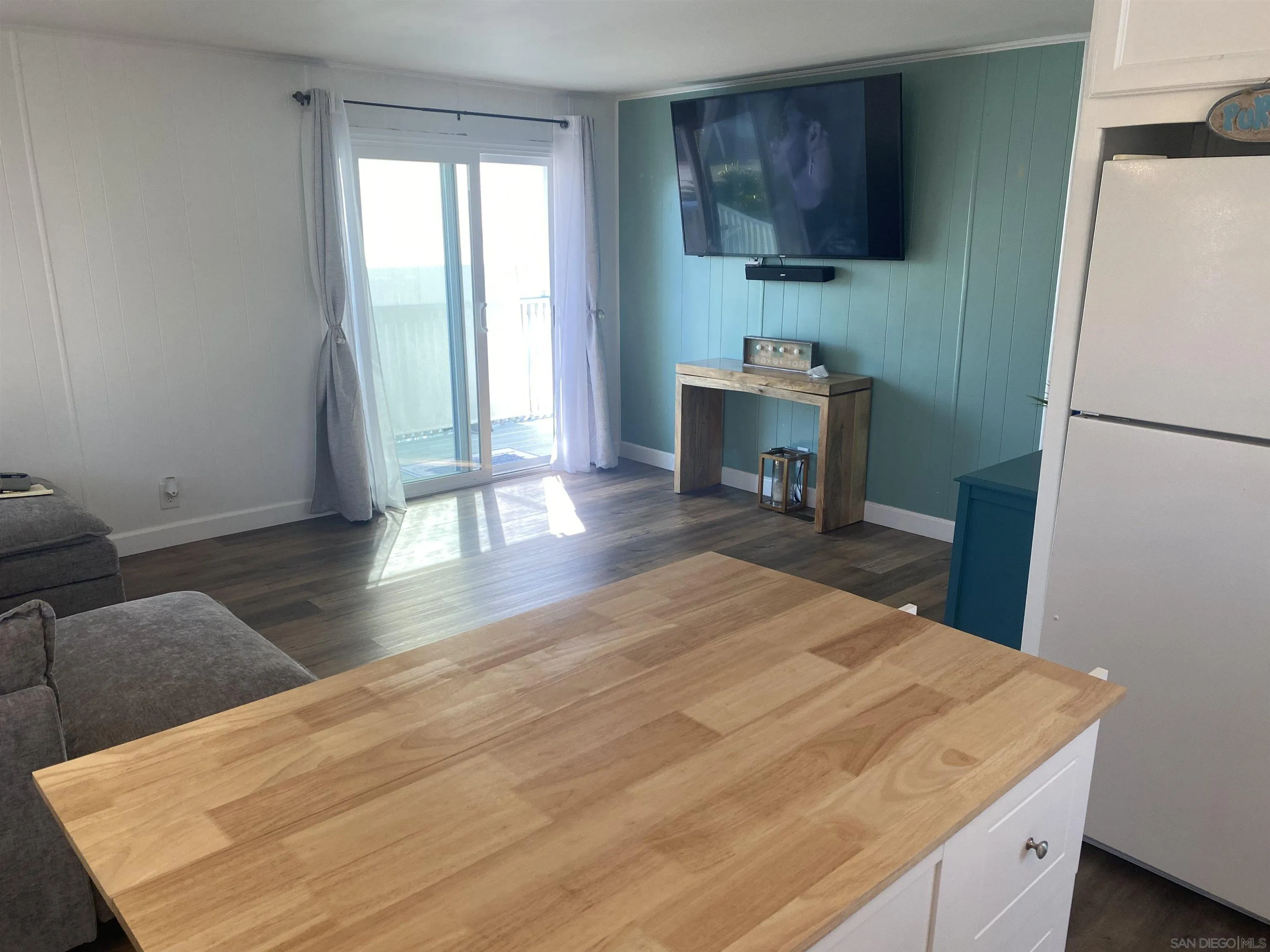 900 North Cleveland Street, Unit 33 Oceanside, CA 92054 - Photo 9 of 23 a room with a bed and a table in it