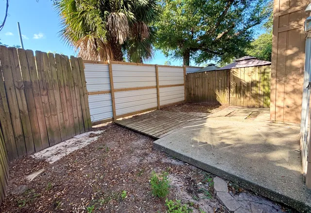 a view of a backyard of the house