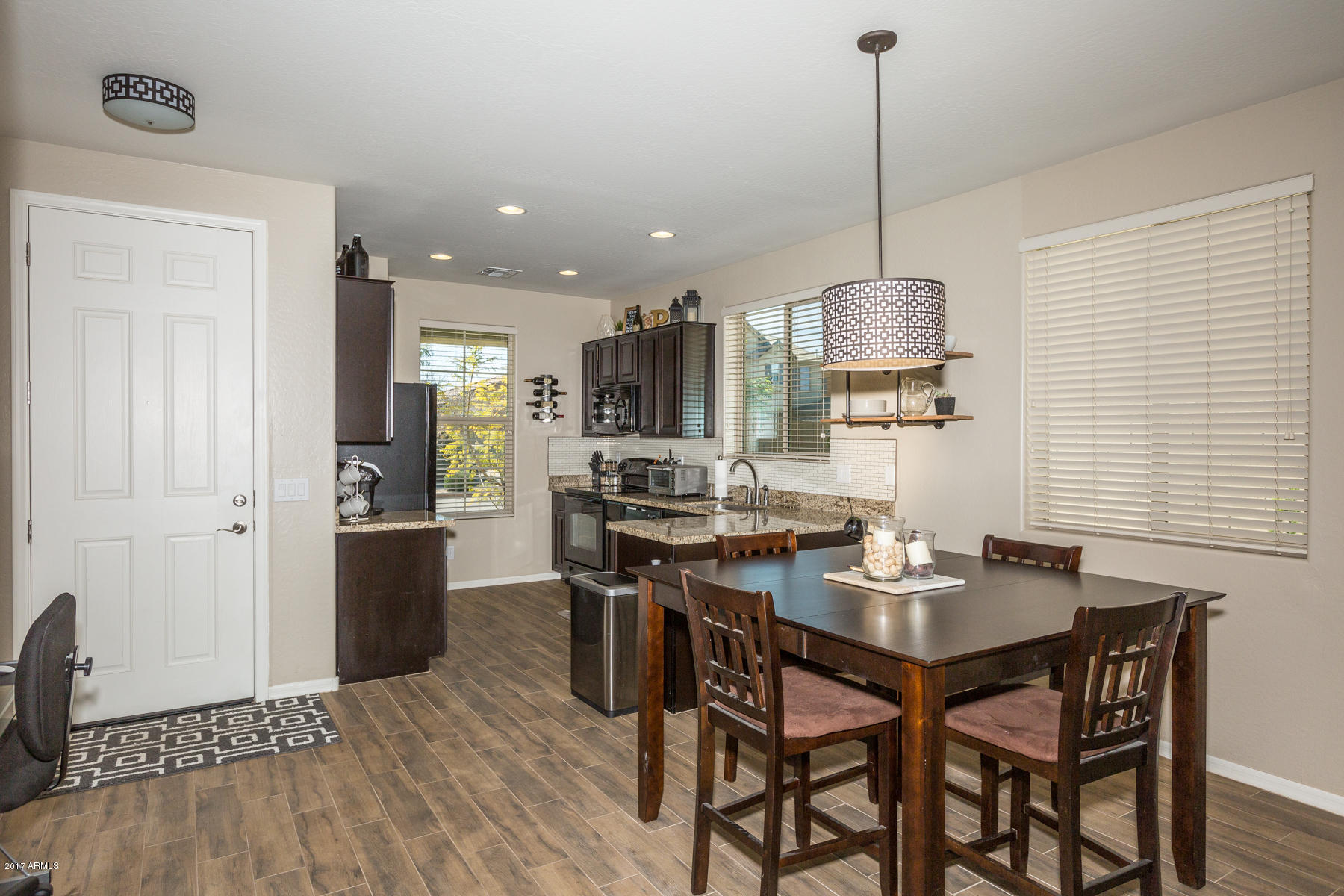 3250 West Florimond Road Phoenix, AZ 85086 - Photo 2 of 31 Dining Room Adjacent to Kitchen