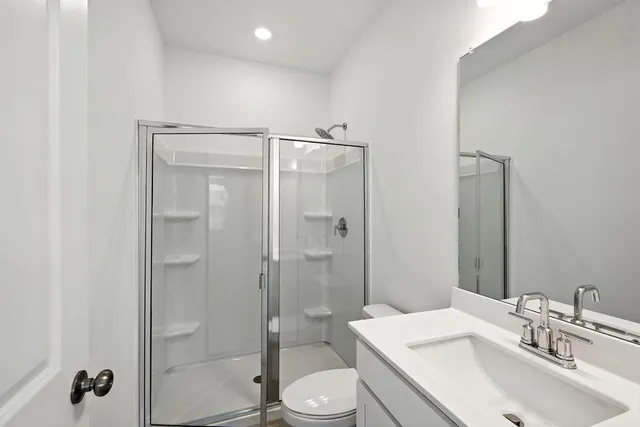 a spacious bathroom with a double vanity sink mirror and double