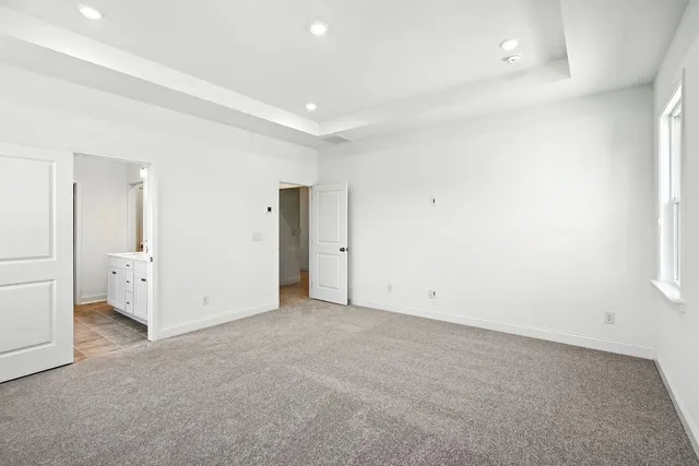 an empty room with closet area