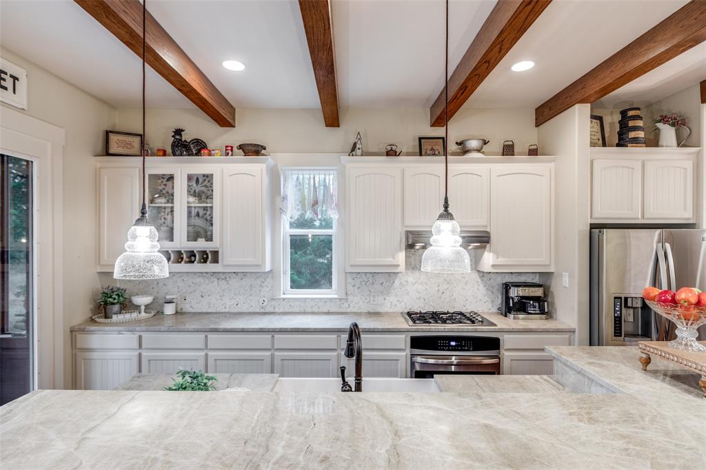 322 Red Maple Road Gunter, TX 75058 - Photo 13 of 33 a living room with furniture and a chandelier