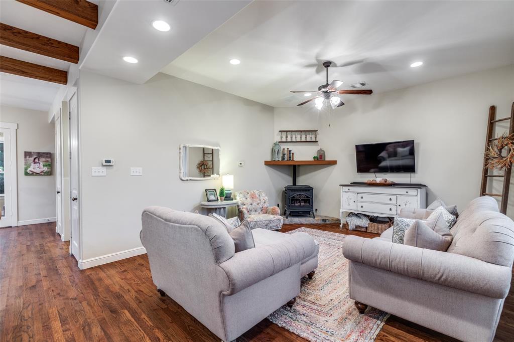 322 Red Maple Road Gunter, TX 75058 - Photo 13 of 33 a living room with furniture and a flat screen tv