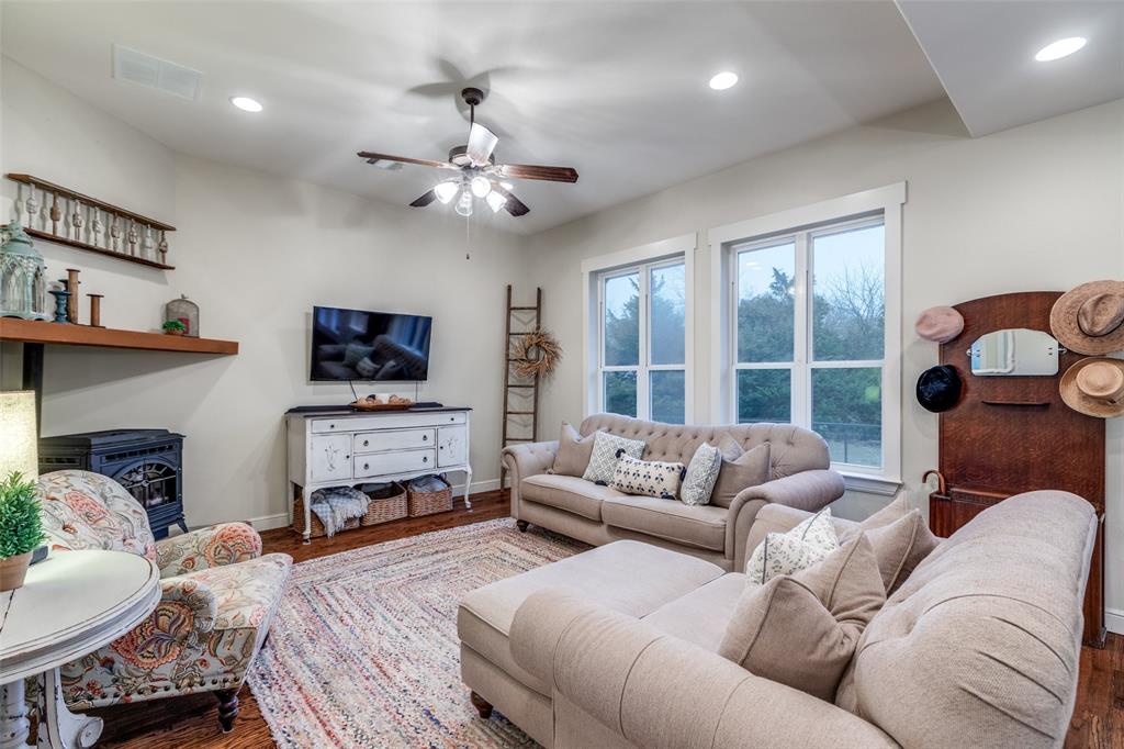 322 Red Maple Road Gunter, TX 75058 - Photo 14 of 33 a living room with furniture and a flat screen tv