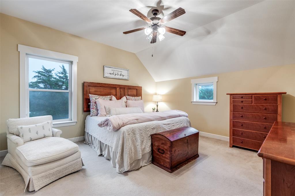 322 Red Maple Road Gunter, TX 75058 - Photo 20 of 33 a bed room with a bed and a ceiling fan