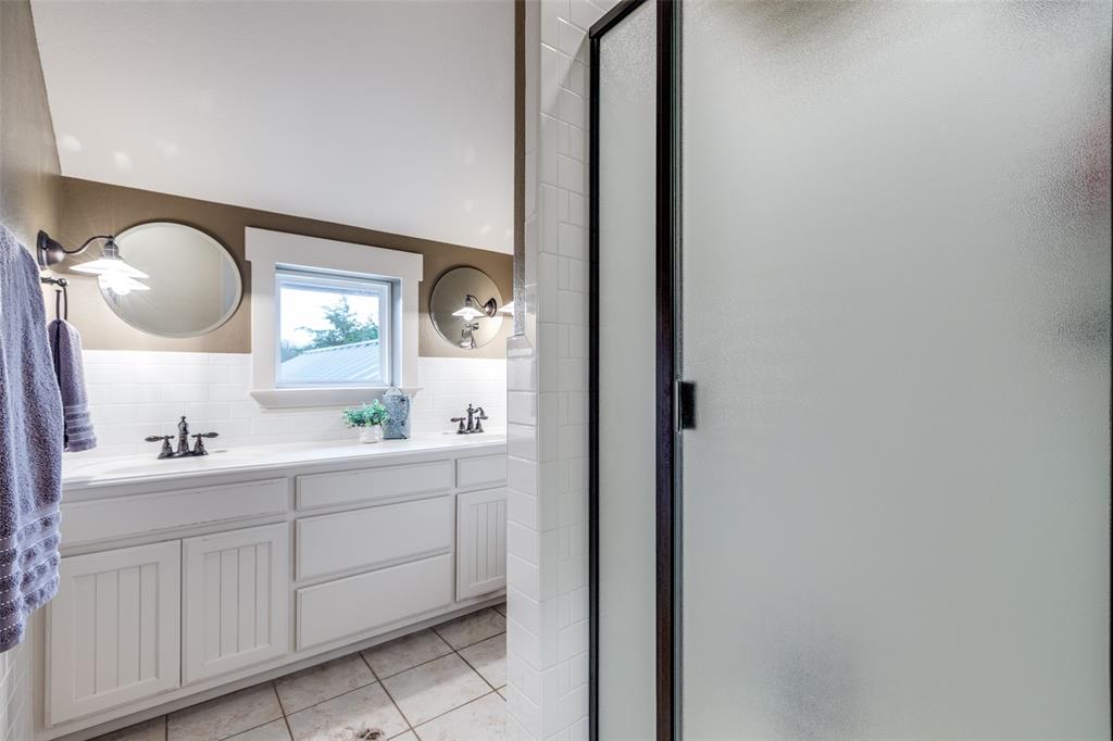 322 Red Maple Road Gunter, TX 75058 - Photo 25 of 33 a en suite bathroom with a toilet sink double vanity and mirror