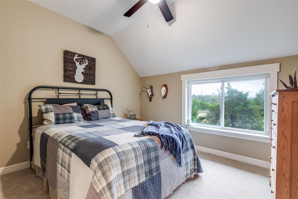 322 Red Maple Road Gunter, TX 75058 - Photo 26 of 33 a bedroom with a bed and a window