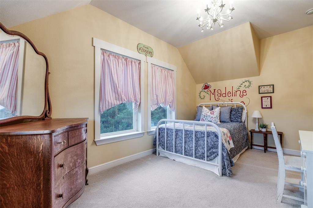 322 Red Maple Road Gunter, TX 75058 - Photo 27 of 33 a bedroom with a bed table and window