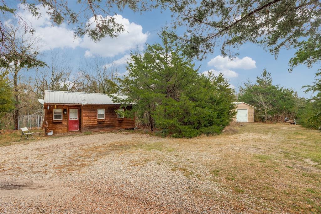 322 Red Maple Road Gunter, TX 75058 - Photo 29 of 33 a front view of a house with a yard and tree s
