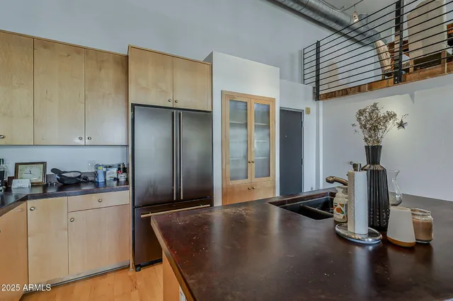 a kitchen with sink and cabinets
