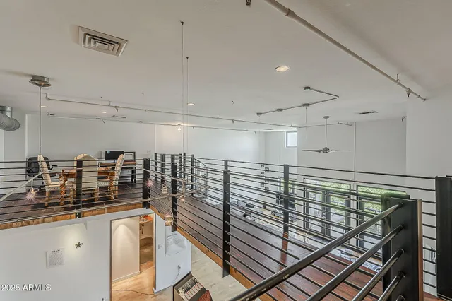 a bathroom with mirror and shower