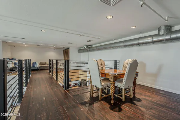 a view of a dining room with furniture and wooden floor