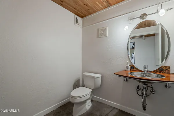 a bathroom with a toilet and a sink